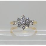 AN 18CT GOLD DIAMOND CLUSTER RING set with estimated approx 0.60cts of brilliant cut diamonds.