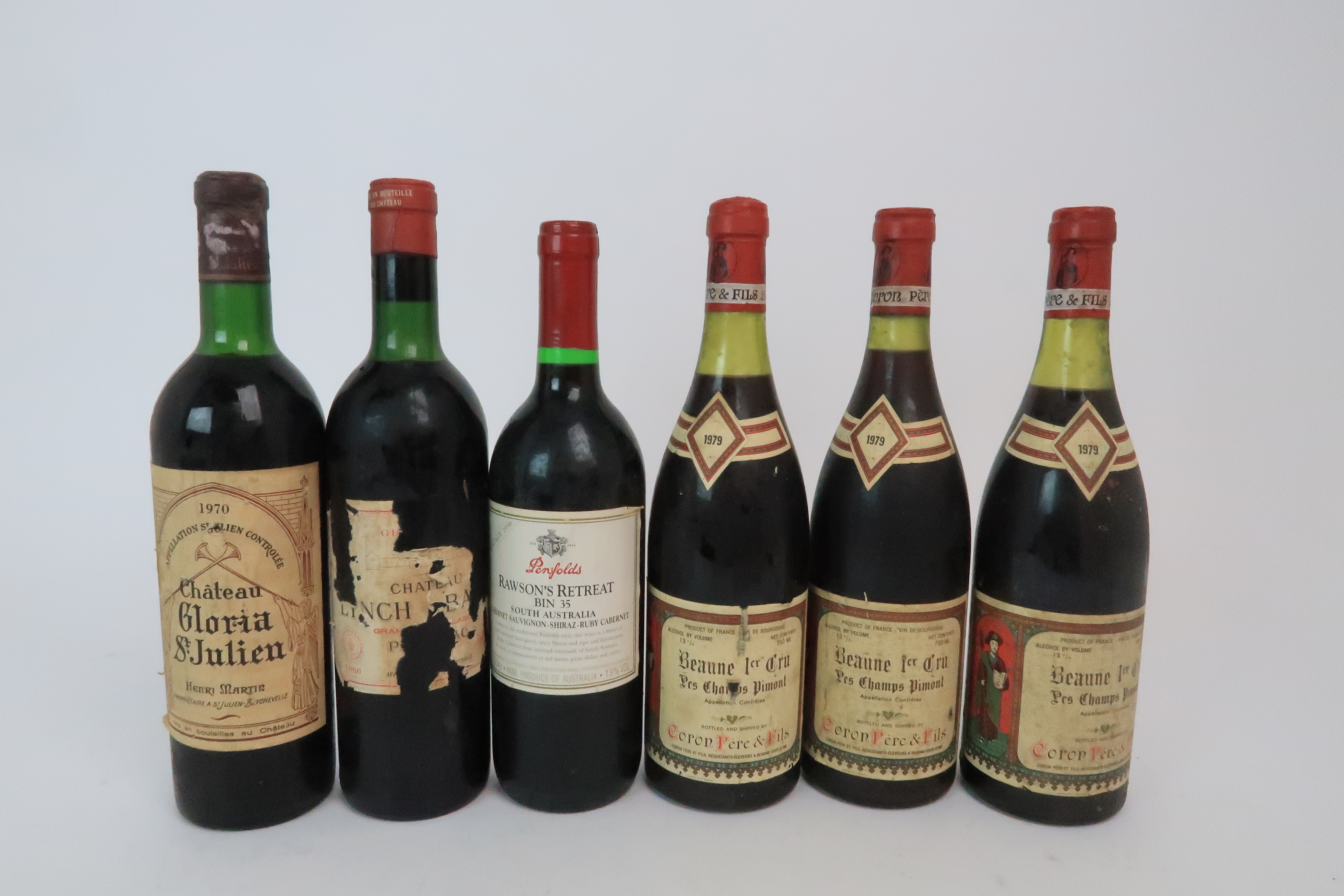 A BOTTLES OF CHATEAU LYNCH BAGES, 1966 label poor, Chateau Gloria St Julien, 1970 and three