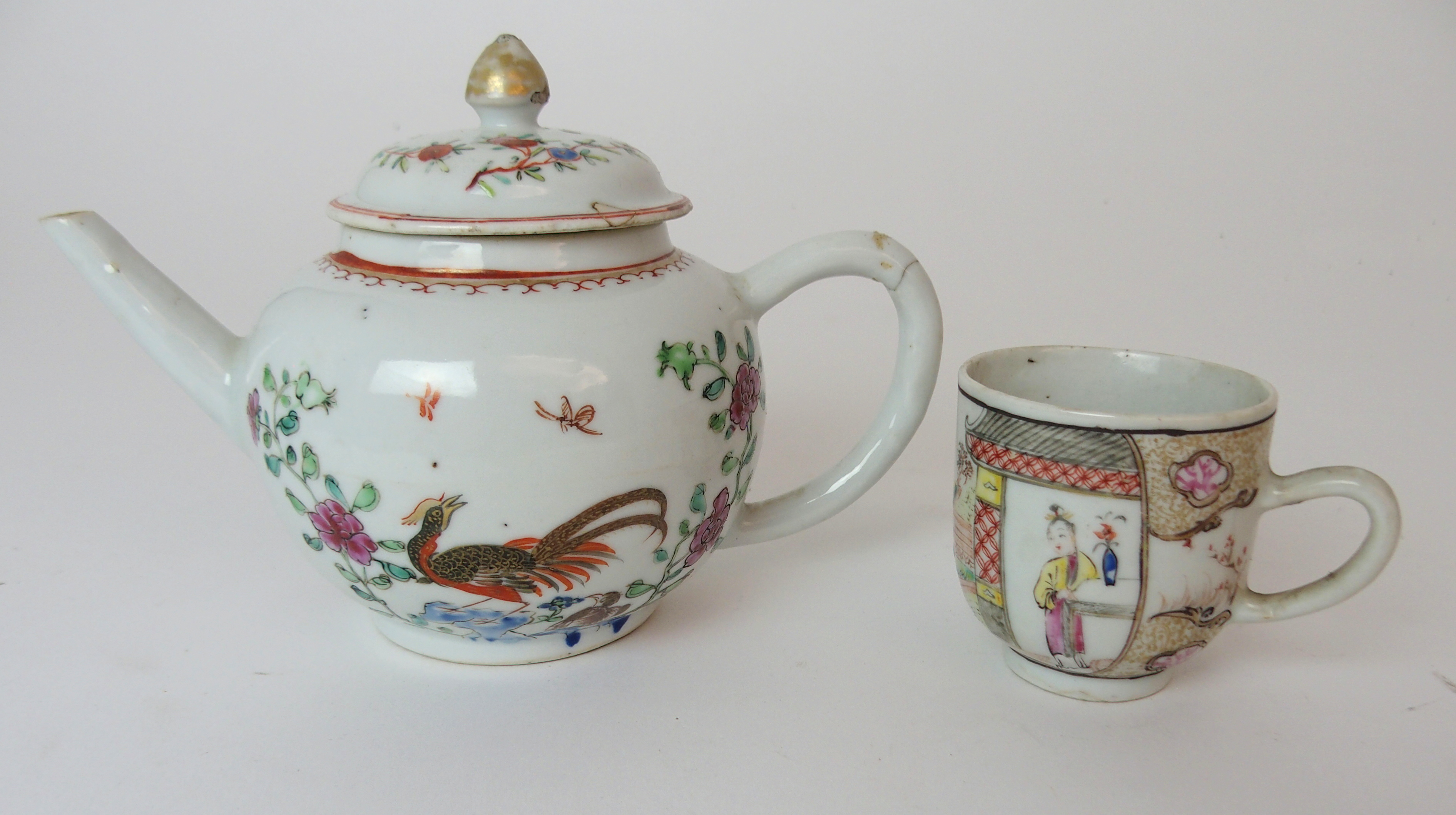 A CHINESE EXPORT TEAPOT AND COVER painted with exotic birds amongst peonies and rockwork