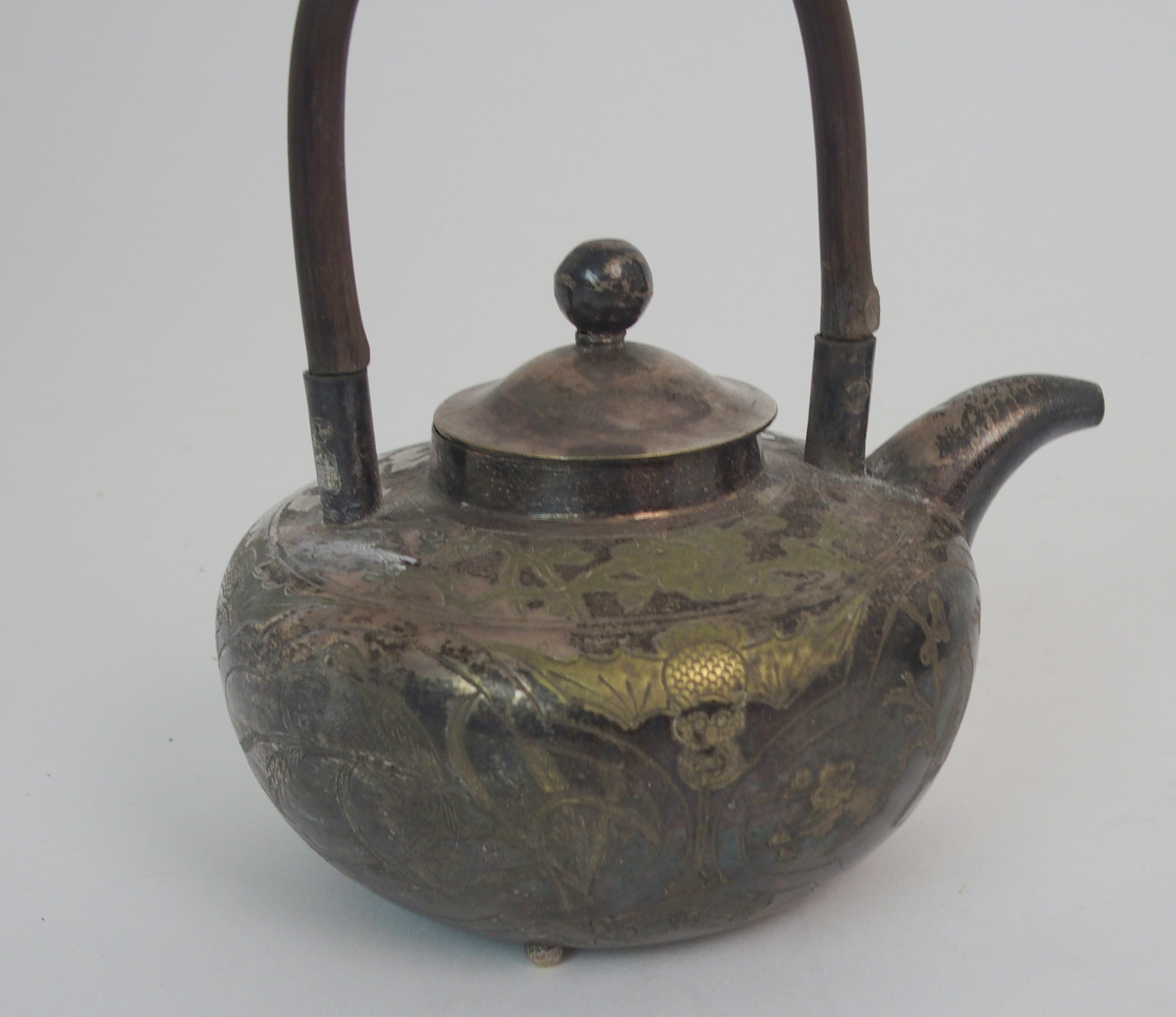 A CHINESE WHITE METAL TEAPOT engraved with panels of fish, birds, foliage and a figure divided by - Image 3 of 7