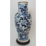 A LARGE CHINESE BLUE AND WHITE MOULDED VASE painted with birds and bats amongst peonies
