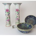 A PAIR OF CHINESE FAMILLE ROSE TRUMPET VASES each painted with exotic birds on rockwork