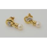 A PAIR OF 18CT GOLD DIAMOND ACCENT AND WHITE PEARL EARRINGS length 2.1cm, diameter of the pearls 6.