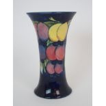 A MOORCROFT WISTERIA PATTERN VASE of trumpet form, with impressed and painted marks to base, 20cm