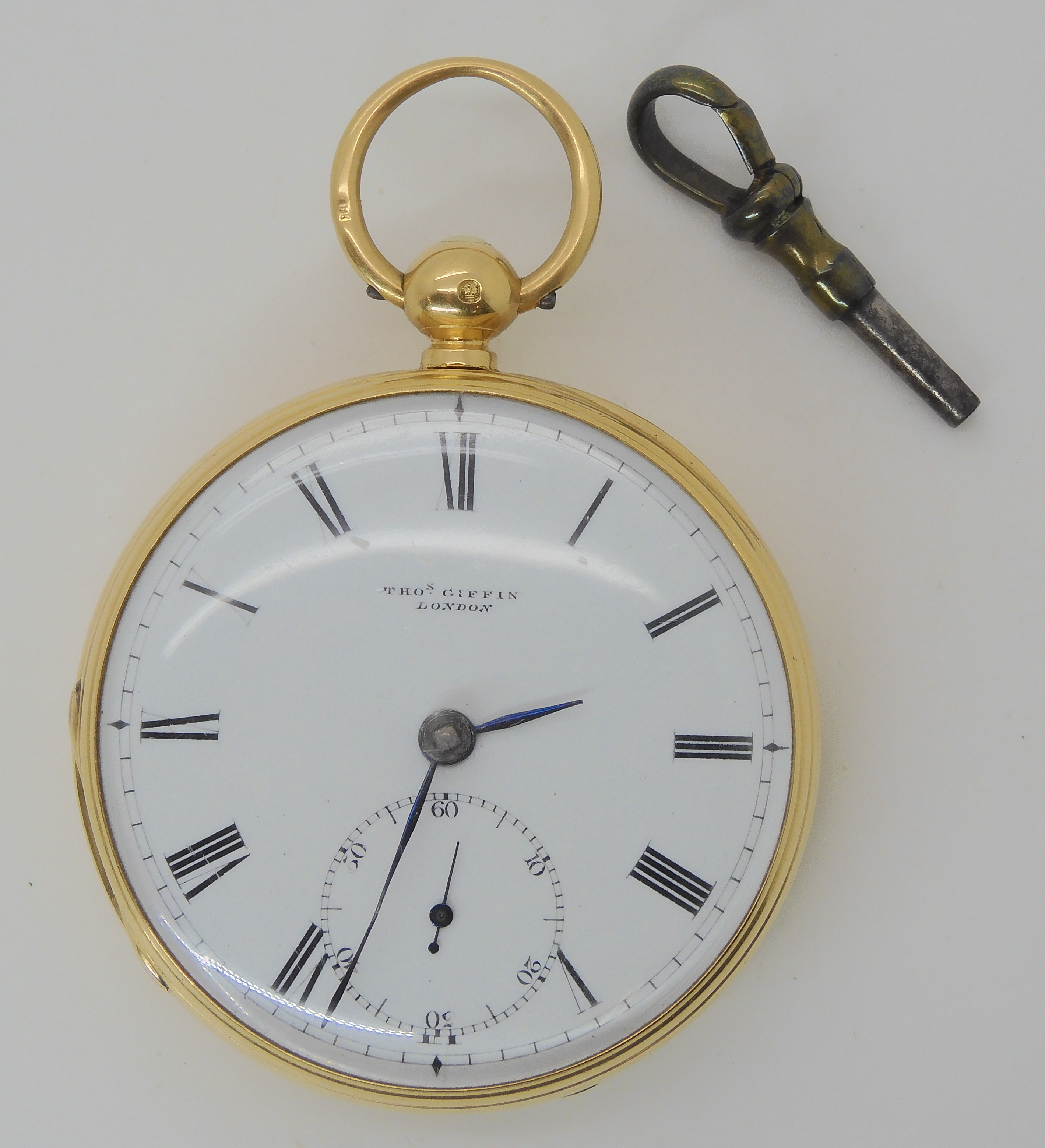 AN 18CT GOLD OPEN FACE POCKET WATCH with a white enamelled dial black Roman numerals, and subsidiary