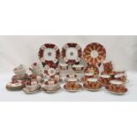 A JOHN ROSE AND CO COALPORT TEASET the maroon ground with gilt and peach decoration, painted pattern