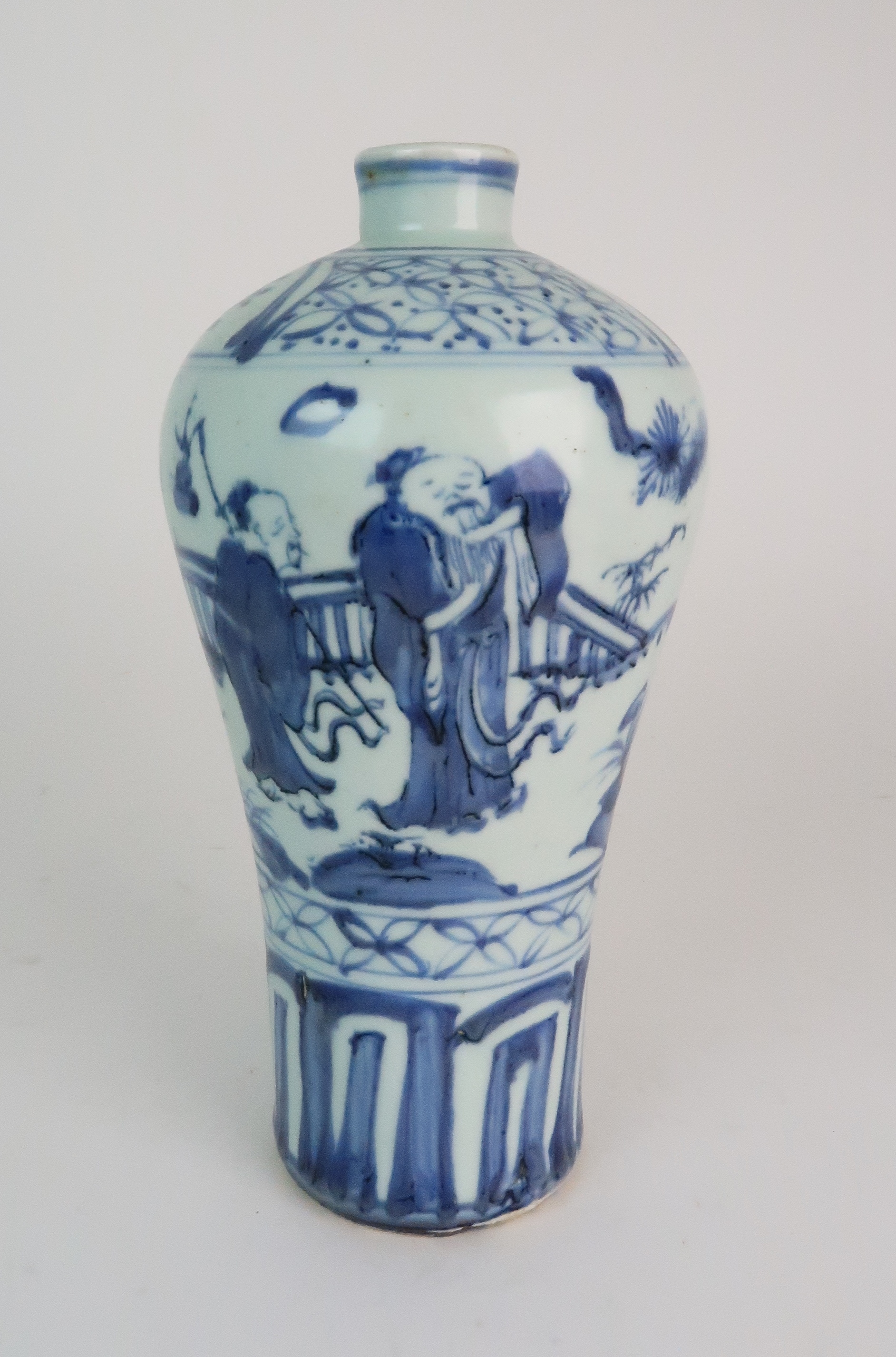 A MING STYLE BLUE AND WHITE BALUSTER VASE painted with three figures in a fenced garden, within