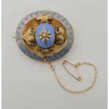 A YELLOW METAL ENAMELLED MOURNING BROOCH a pearl is set to the star in the centre with pale blue