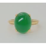 A 14K GREEN HARDSTONE SET RING Finger size M, weight 3.6gms Condition Report: Available upon