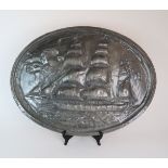 AN OVAL BEATEN PEWTER WALL PLAQUE OF THE DUNCAN RITCHIE 52 x 70cm Condition Report: Available upon