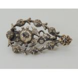 A YELLOW AND WHITE METAL HALLEY'S COMET BROOCH set with rose cut diamonds, made to commemorate the