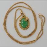 A CHINESE GREEN HARDSTONE AND DRAGON PENDANT the pendant with a green hardstone of approx 13mm x