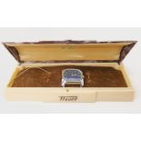 A LADIES TISSOT WATCH HEAD IN ORIGINAL BOX with metallic blue dial, white baton numerals and