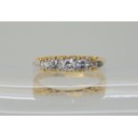 AN 18CT FIVE STONE DIAMOND RING set with estimated approx 0.28cts of brilliant cut diamonds, in a