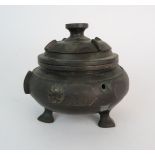 A CHINESE BRONZE CENSOR The archaic style form cast with a pair of grotesque mask handles, the
