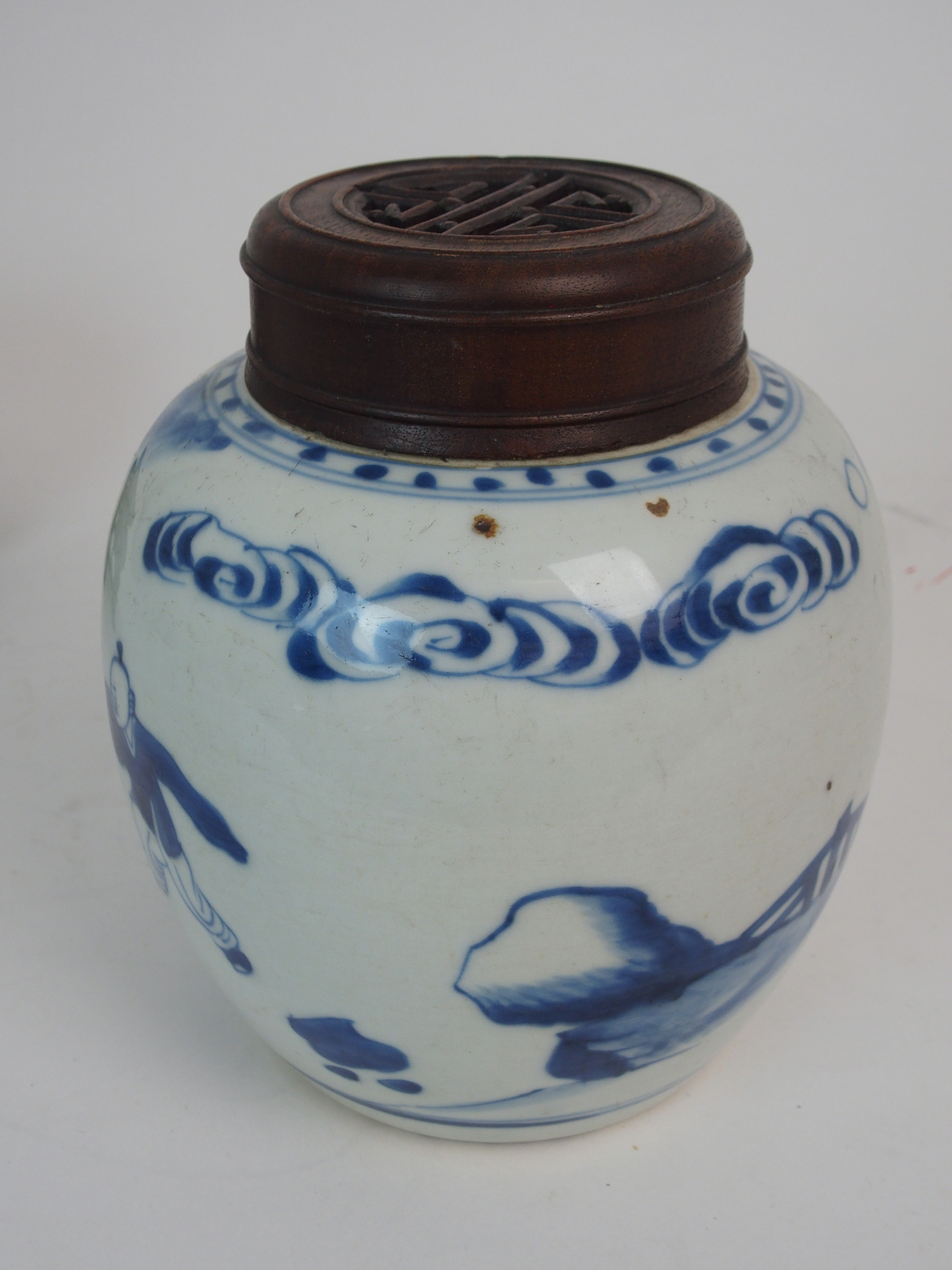 A CHINESE BLUE AND WHITE GINGER JAR painted with children at play, 15.5cm high, wood stand and cover - Image 3 of 7