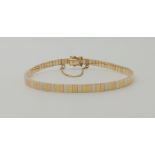 A 9CT TRICOLOUR GOLD BRACELET with polished block links, length 18.5cm, weight 11.3gms Condition