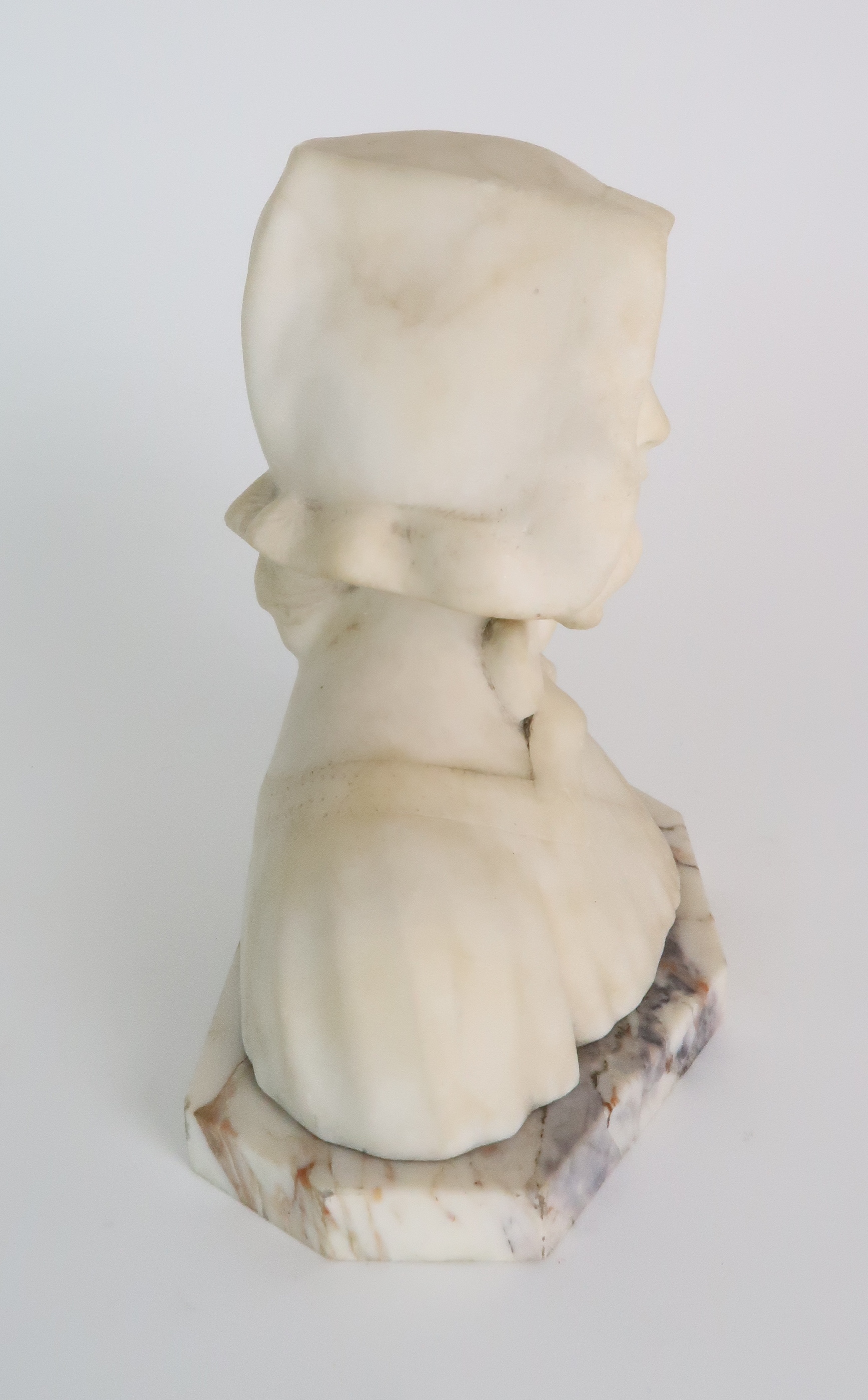 AN ALABASTER BUST OF A GIRL IN A BONNET upon onyx base, 20cm high Condition Report: Available upon - Image 4 of 6