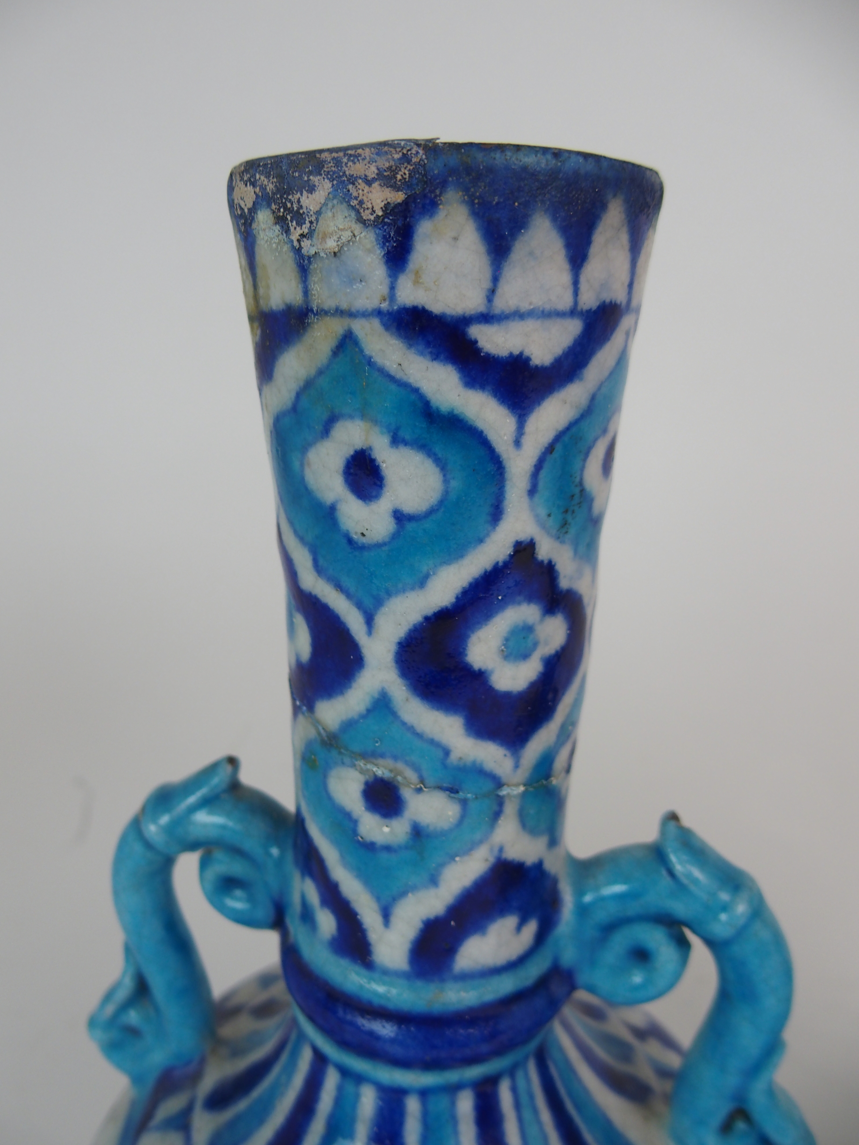 A PAIR OF PERSIAN POTTERY BLUE AND WHITE TWO HANDLED VASES painted with flowers and foliage, with - Image 2 of 11