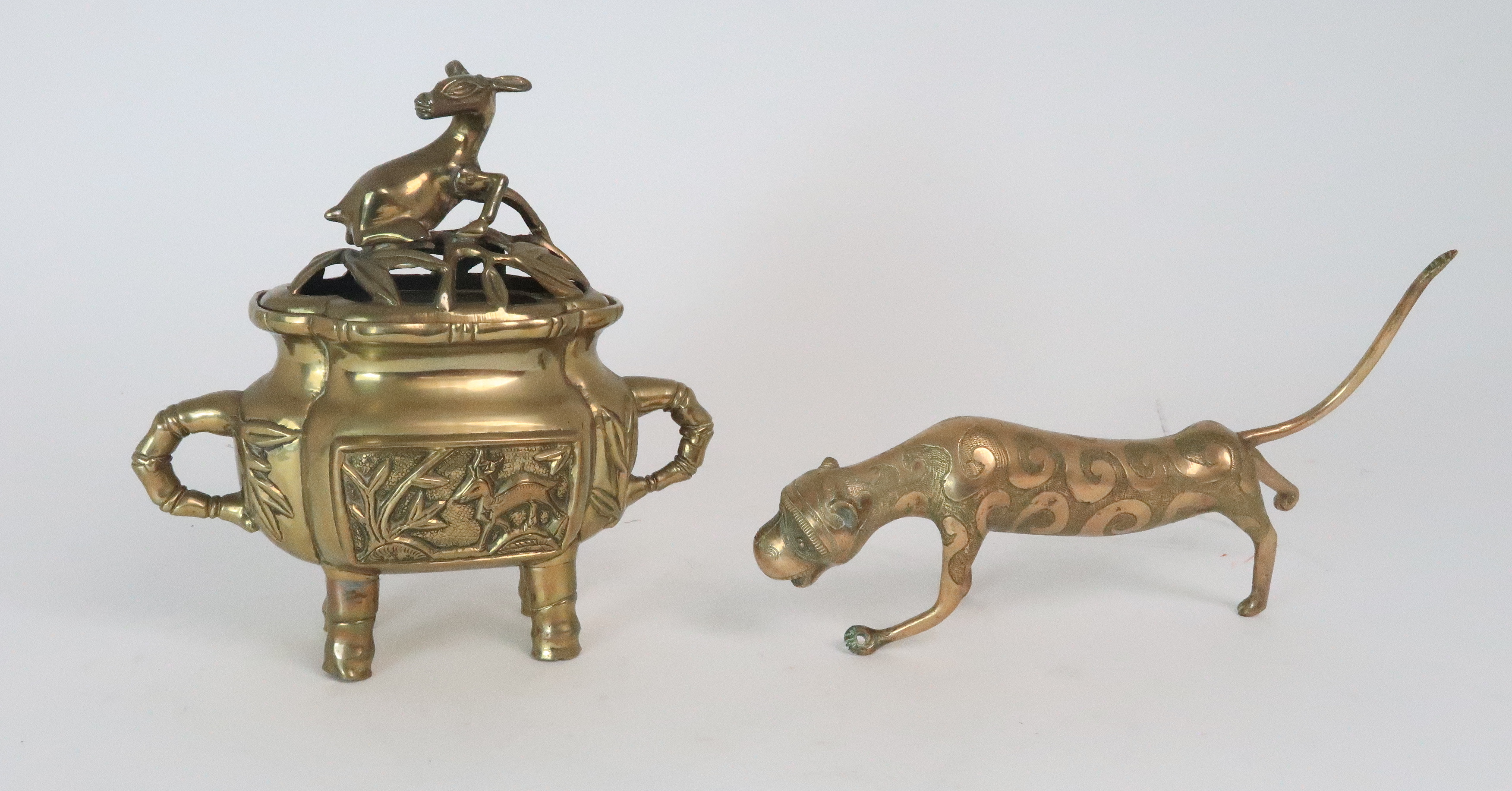 *WITHDRAWN* A CHINESE BRASS CENSOR AND OIERCED COVER cast with deer finial above panels of animals