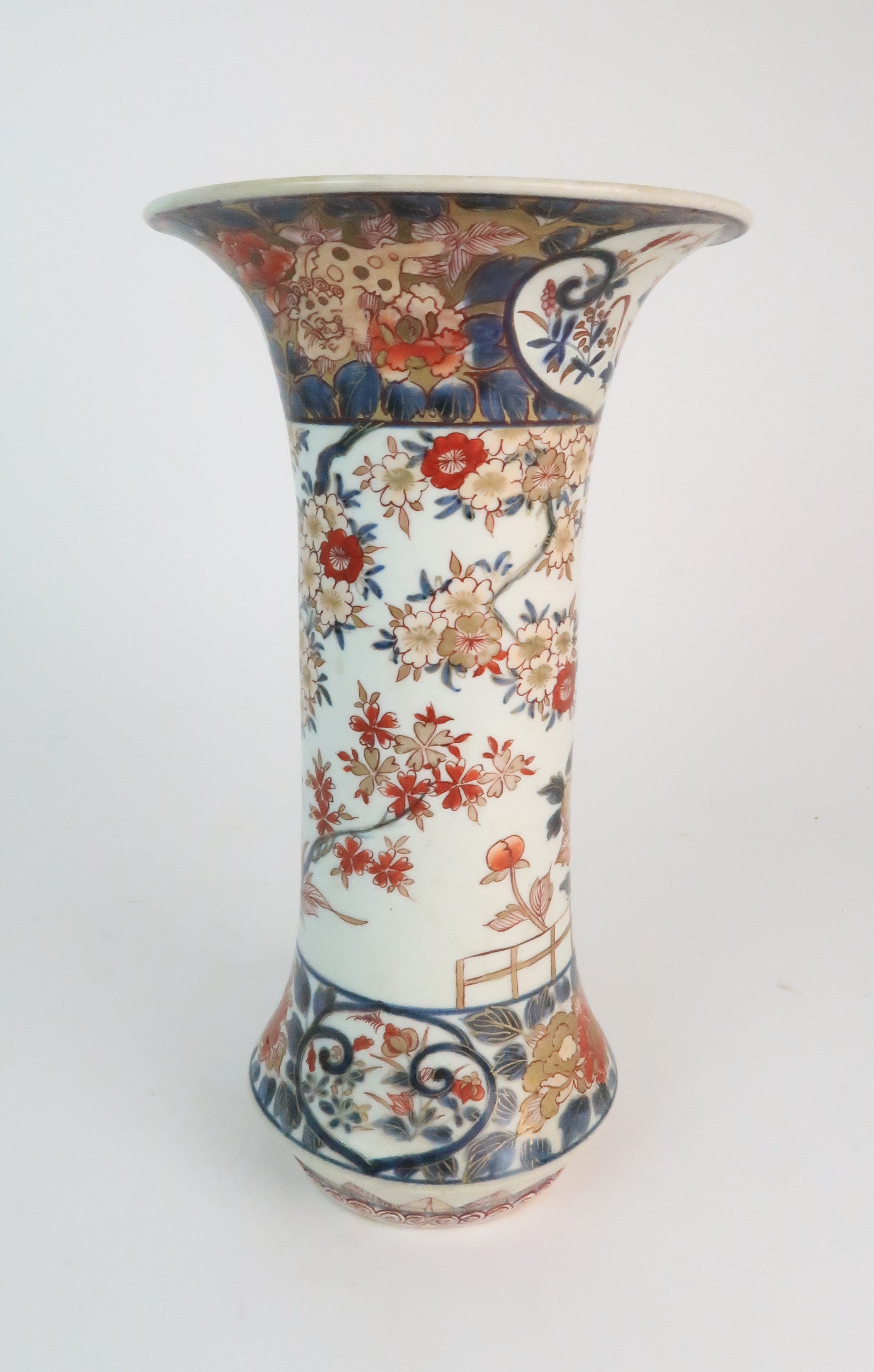 A JAPANESE IMARI FLARED CYLINDRICAL VASE painted with a building on stilts amongst flowering - Image 3 of 10