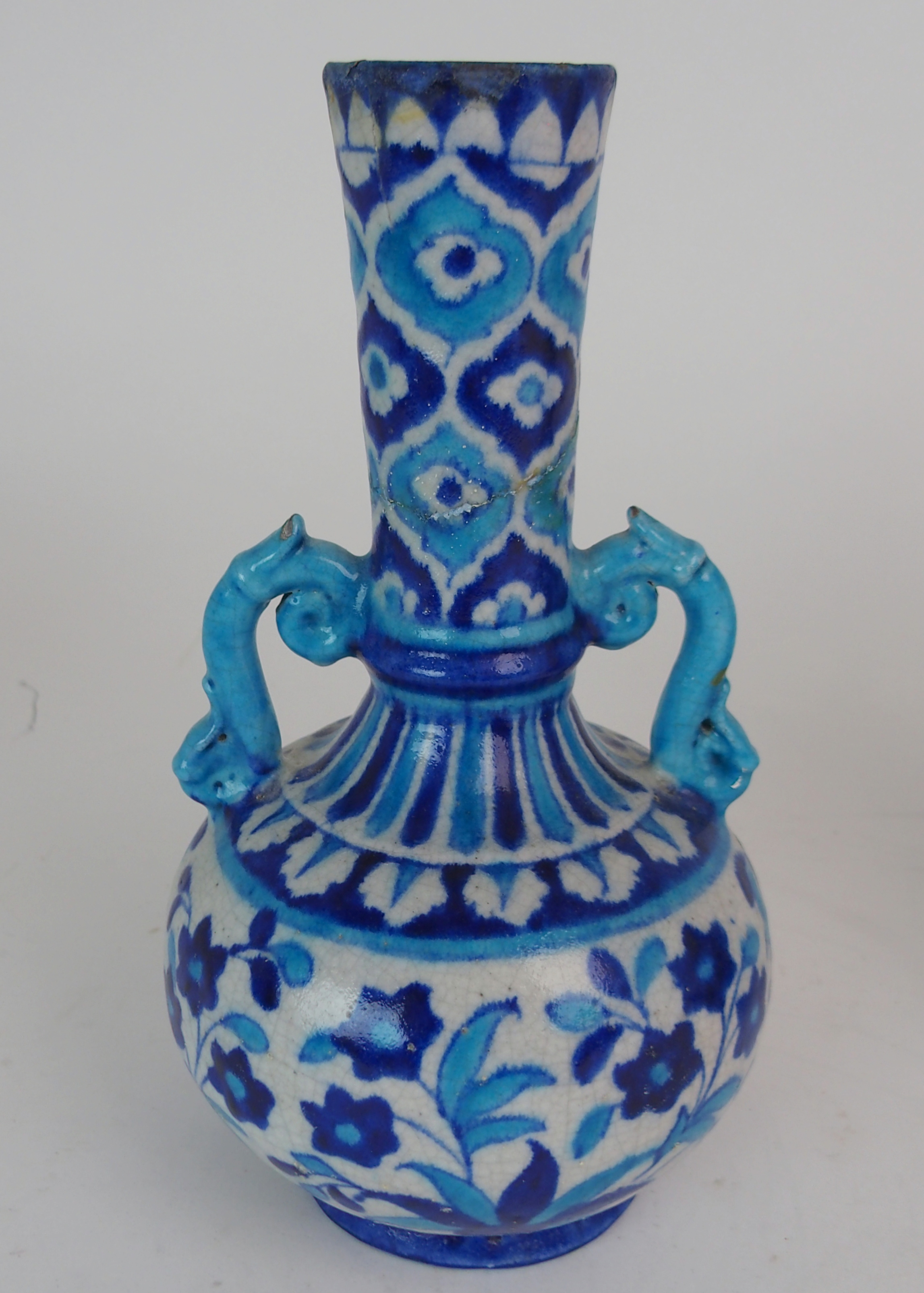 A PAIR OF PERSIAN POTTERY BLUE AND WHITE TWO HANDLED VASES painted with flowers and foliage, with - Image 3 of 11