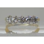 AN 18CT GOLD FIVE STONE DIAMOND RING set with estimated approx 1ct of brilliant cut diamonds, finger