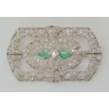 A PLATINUM ART DECO EMERALD AND DIAMOND BROOCH set with pear shaped emeralds of approx 7mm x 4.