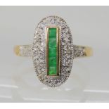 A 9CT GOLD ART DECO STYLE RING set with square cut emeralds and diamond accents, finger size O1/2,