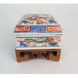 A WUCAI SQUARE SHAPED BOX AND COVER painted with dragons and phoenix, within key pattern, six