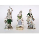 A PAIR OF SITZENDORF FIGURES each modelled with a sheep and decorated with flowers, 18cm high,