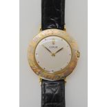 AN 18CT THREE COLOUR GOLD CORUM WATCH with silvered dial, dot numerals and gold hands the case is