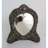 A HEART SHAPED BEVELLED MIRROR in silver mounted frame, maker's mark NC London 1906 32 cm x 27 cm