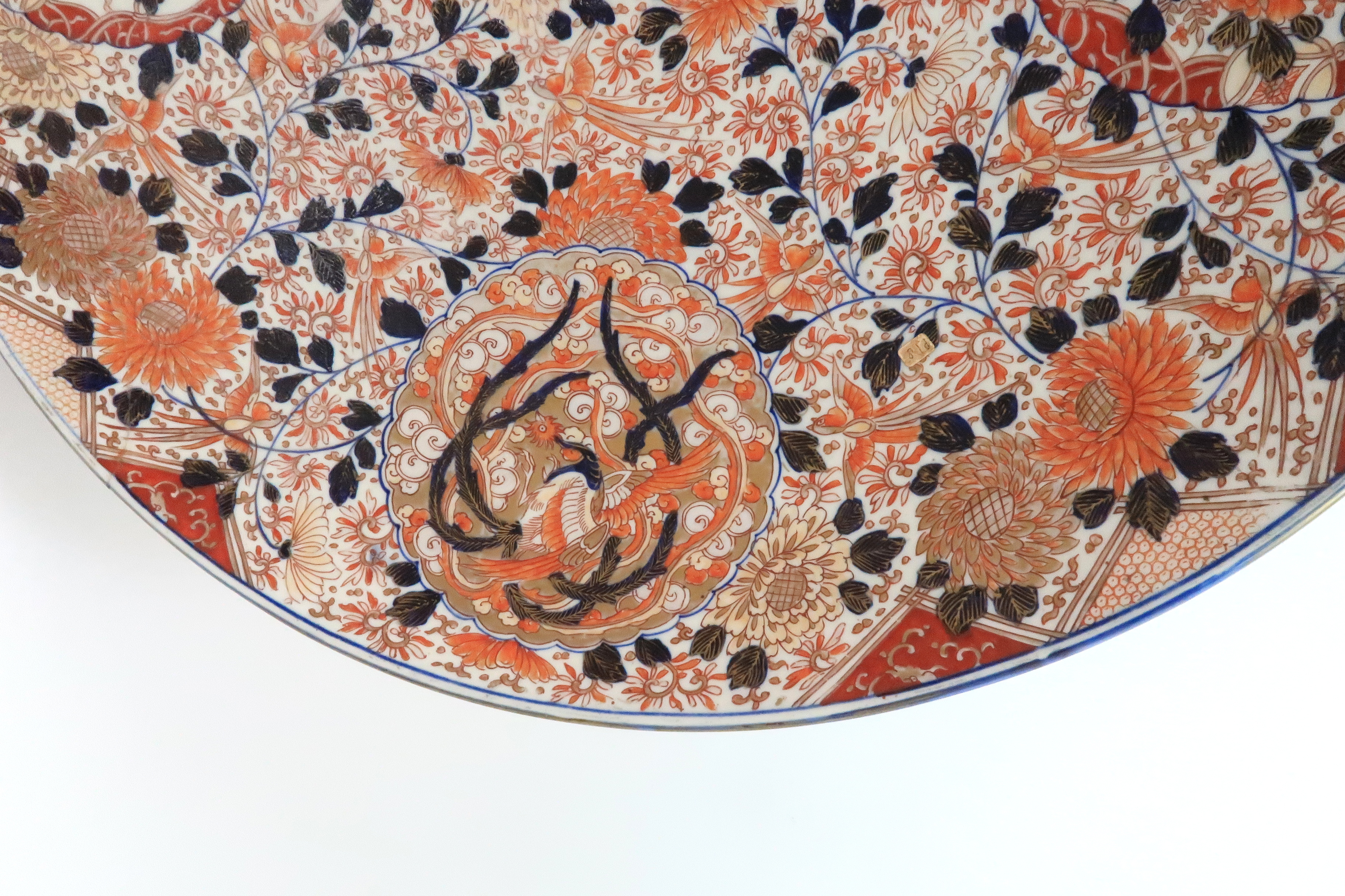 A LARGE IMARI CHARGER painted with birds, scrolling foliage and ribbon tied roundels with Ho-o - Image 4 of 9