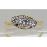 AN 18CT AND PLATINUM THREE STONE RING the three old cut diamonds have a combined weight of 0.