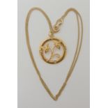 A 14K GOLD PEARL SET EDWARDIAN PENDANT diameter 2.3cm, length of the 9ct curb chain 46cm, weight