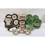 A CRESCENT CHINA DESSERT SERVICE each piece hand painted centrally with fruit, surrounded by a green