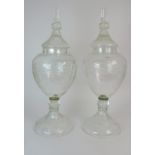 A PAIR OF LARGE CUT GLASS CHEMISTS DISPLAY JARS AND COVERS 78cm high Condition Report: Available