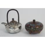 A CHINESE WHITE METAL TEAPOT engraved with panels of fish, birds, foliage and a figure divided by