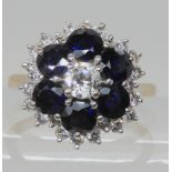 AN 18CT WHITE GOLD DIAMOND AND SAPPHIRE FLOWER CLUSTER RING set with estimated approx 1ct of