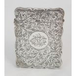 A SILVER CARD CASE by Robert Chandler, Birmingham 1920, of rectangular shape with engraved foliate