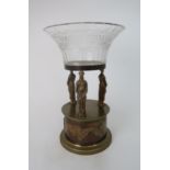 AN EMPIRE STYLE GILT METAL AND CUT GLASS TAZZA with three standing classical female figures on