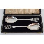 A PAIR OF SILVER SALAD SERVERS by Lanson Ltd, Birmingham 1945, the terminals with pierced