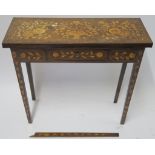 A DUTCH MARQUETRY WALNUT GAMES TABLE decorated with a basket of flowers, birds and scrolling