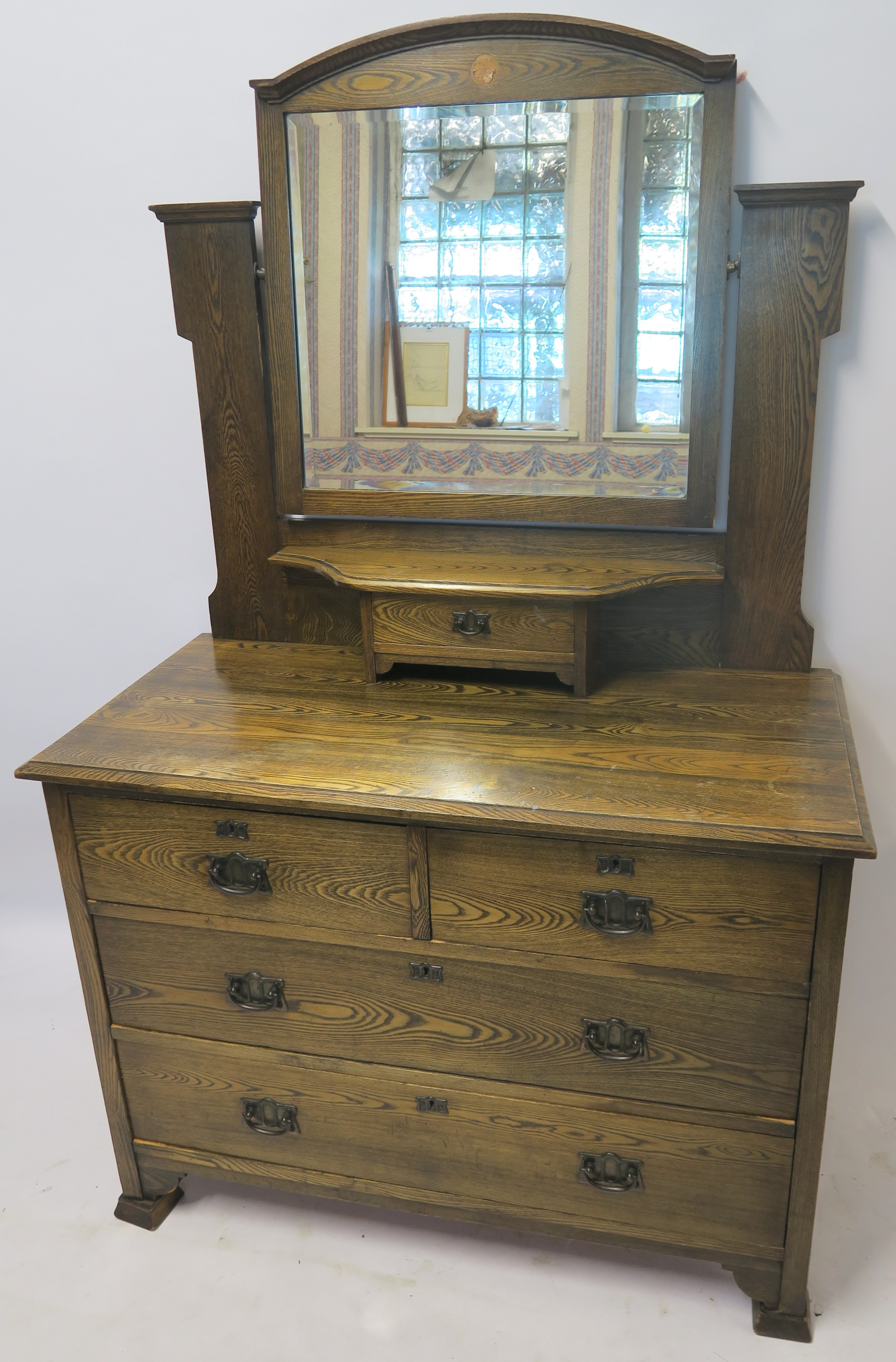 AN OAK ARTS AND CRAFTS DRESSING TABLE 158cm high , 100cm wide and 48cm deep Condition Report: