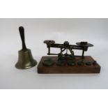 A PAIR OF BRASS POSTAL SCALES a small hand bell, no clapper and a pair of Kershaw Bino Prism no 2 MK