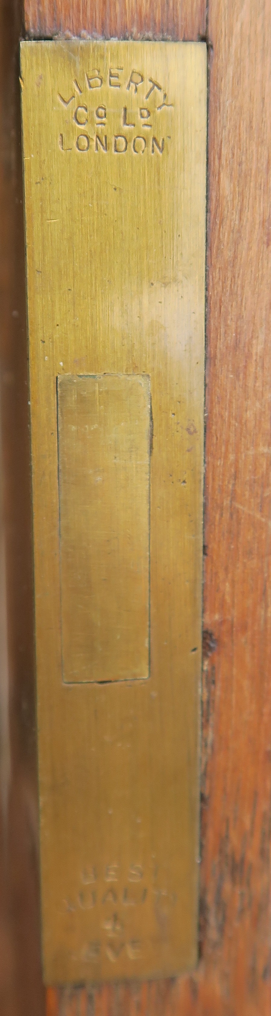 A LIBERTYS OF LONDON OAK ARTS AND CRAFTS SIDEBOARD the overhanging cornice above a leaded glass - Image 9 of 15