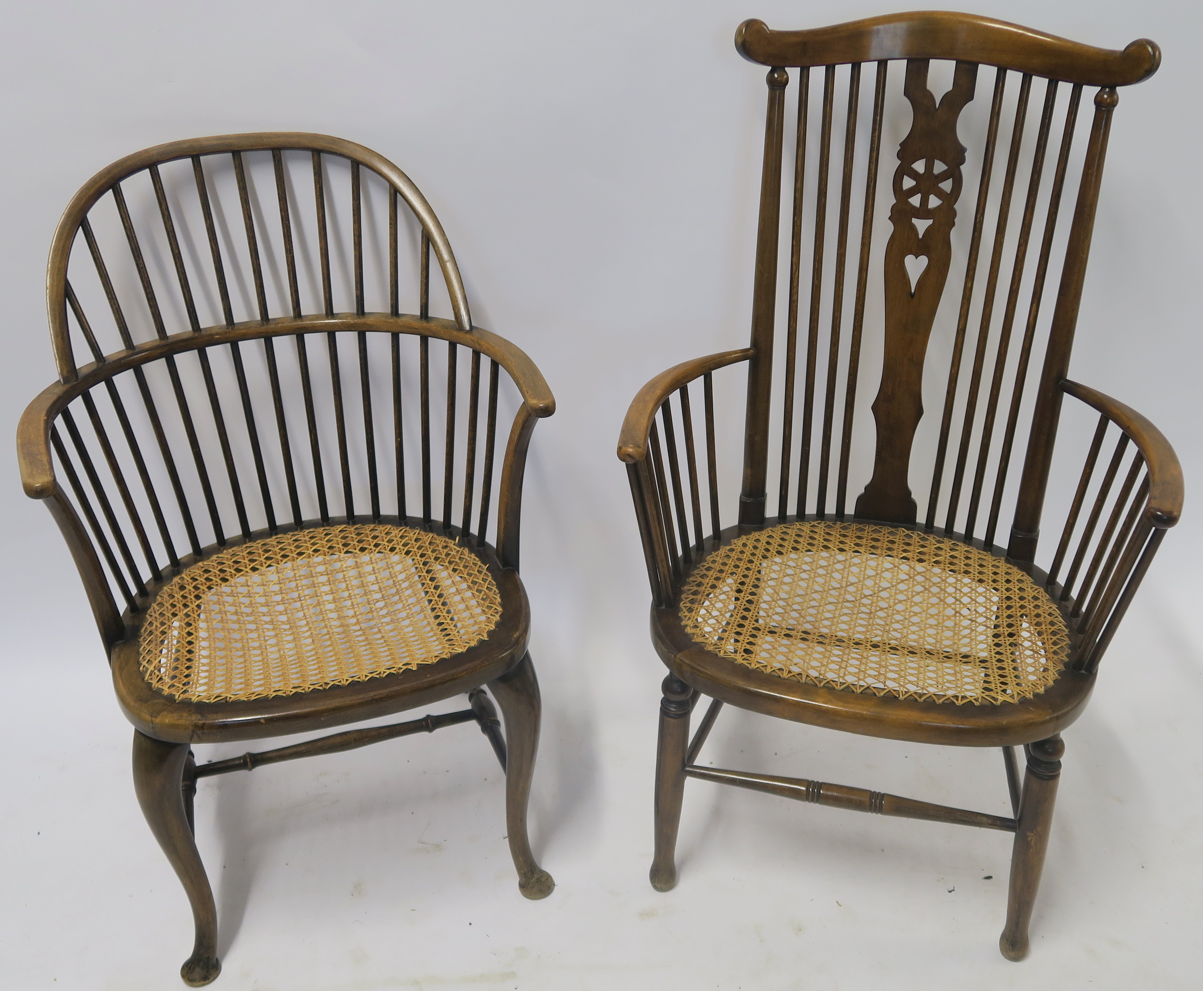 TWO FRUITWOOD WINDSOR ARMCHAIRS with cane seats 94cm and 81cm high (2) Condition Report: Available