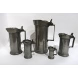 FIVE LECLERC HUMBERT GRADUATED PEWTER FLAGONS with hinged lids ranging from demi decilitre to double