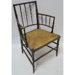 A WILLIAM MORRIS SUSSEX CHAIR of standard form with rush seat, 88cm high Condition Report: